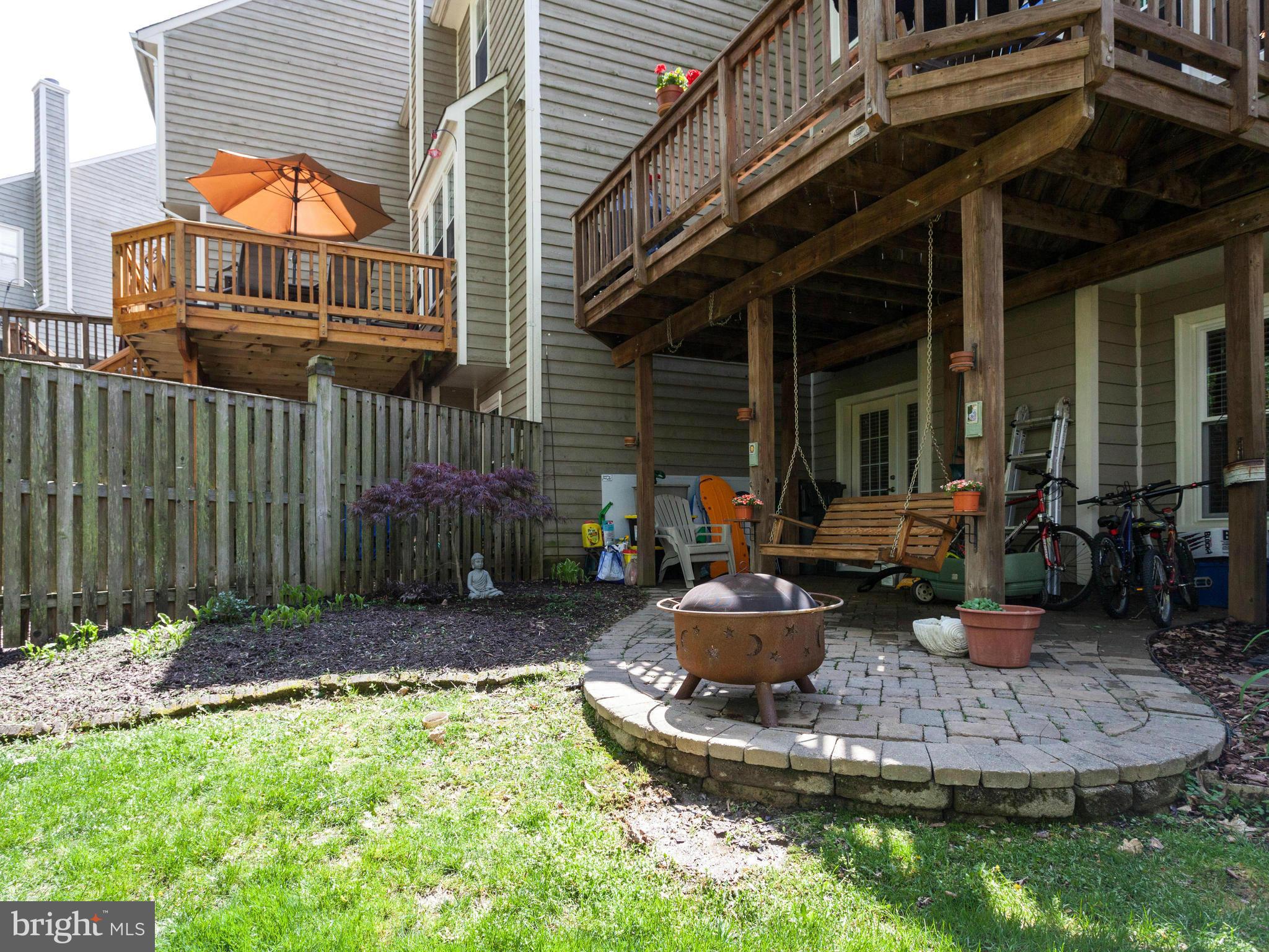 1215 Weatherstone Court Reston, VA 20194 - Photo 29 of 30 a view of a house with backyard and sitting area
