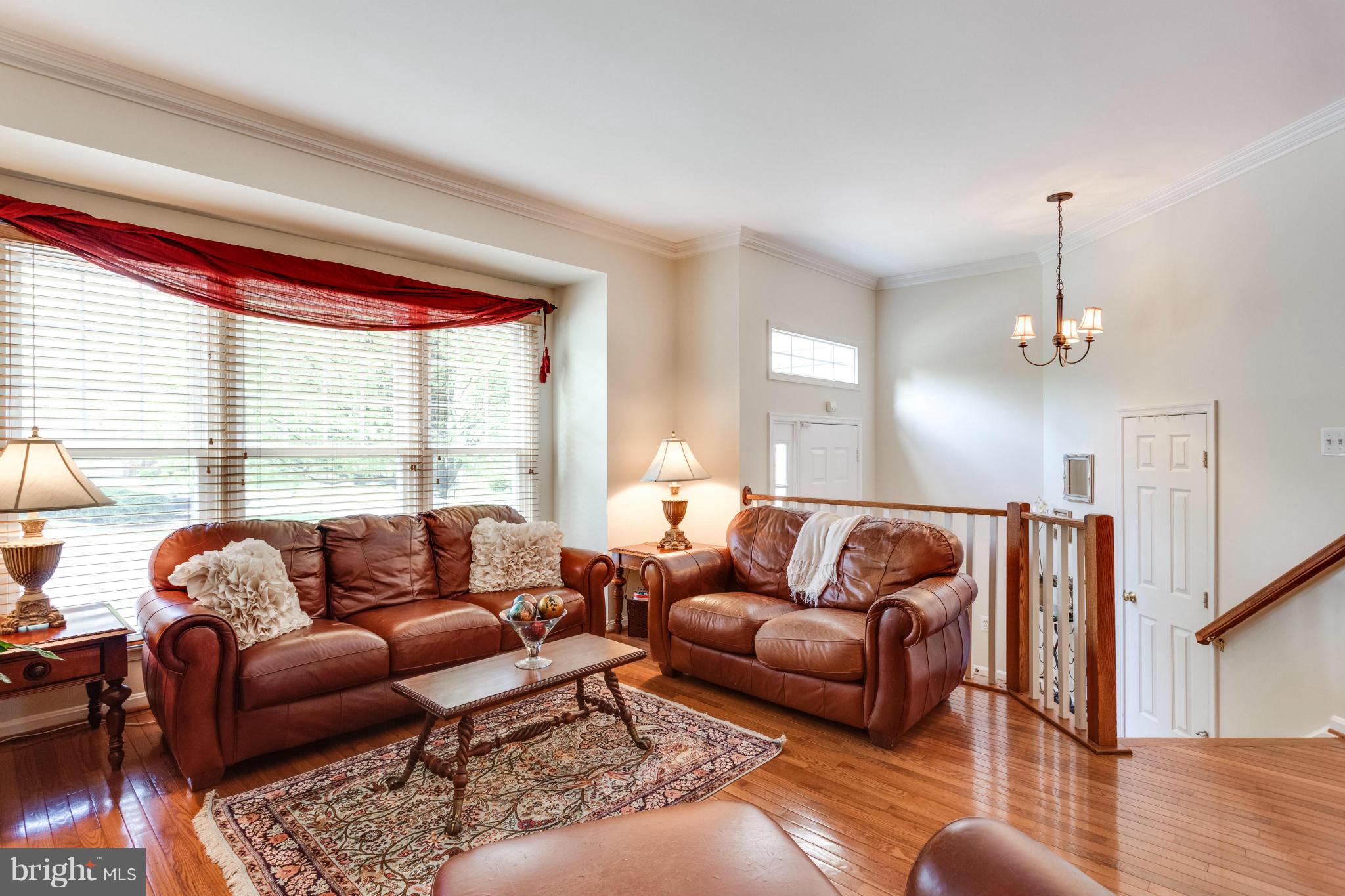 1215 Weatherstone Court Reston, VA 20194 - Photo 4 of 30 a living room with furniture and a large window