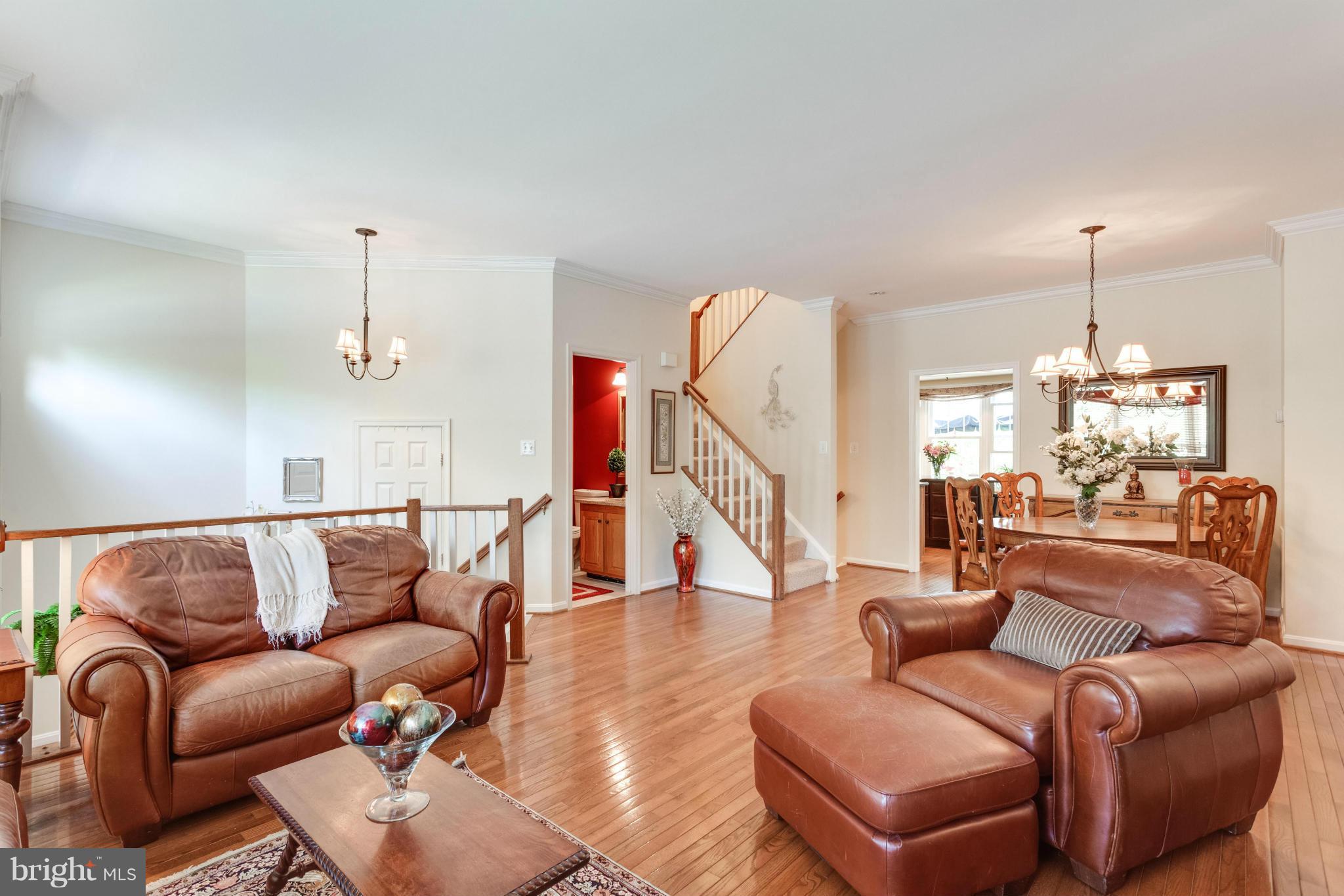 1215 Weatherstone Court Reston, VA 20194 - Photo 5 of 30 a living room with furniture and a wooden floor