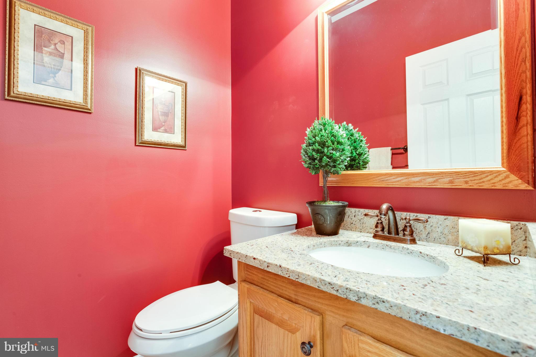 1215 Weatherstone Court Reston, VA 20194 - Photo 7 of 30 a bathroom with a granite countertop toilet sink and mirror