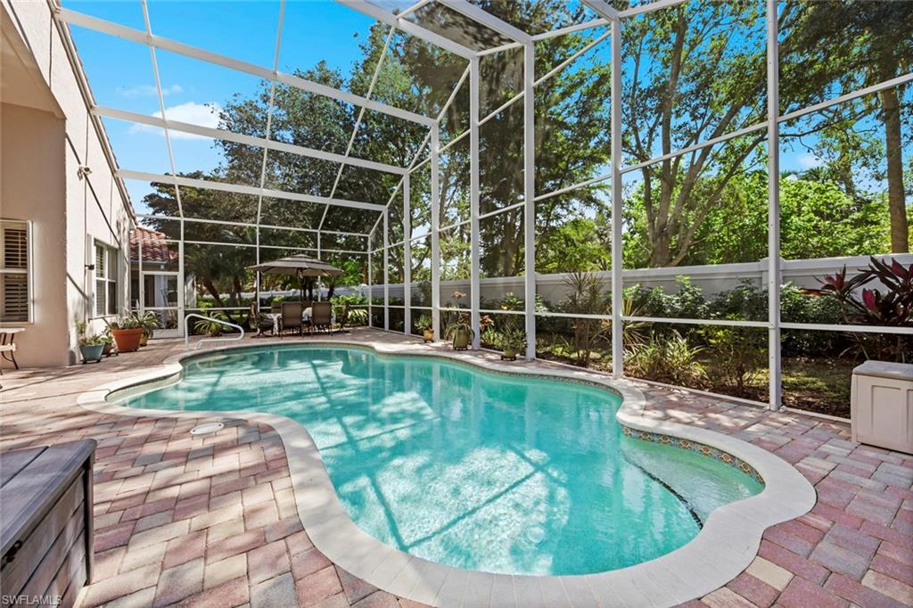 9006 Whitfield Drive Estero, FL 33928 - Photo 1 of 43 a view of a swimming pool with a patio