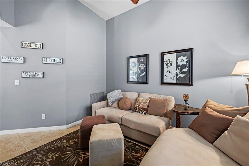 9006 Whitfield Drive Estero, FL 33928 - Photo 15 of 43 a living room with furniture and painting on the wall