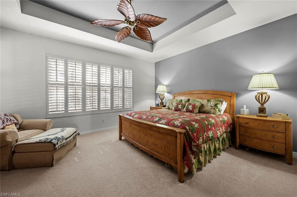 9006 Whitfield Drive Estero, FL 33928 - Photo 17 of 43 a bedroom with a bed couch and window