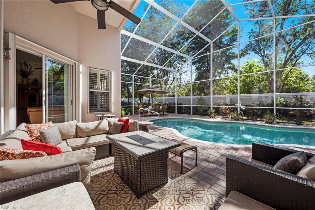 9006 Whitfield Drive Estero, FL 33928 - Photo 27 of 43 a view of a patio with couches and a backyard