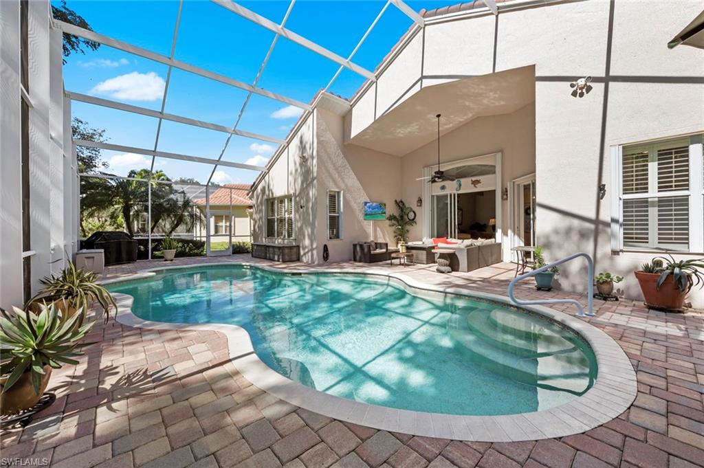 9006 Whitfield Drive Estero, FL 33928 - Photo 30 of 43 a view of a house with backyard porch and sitting area