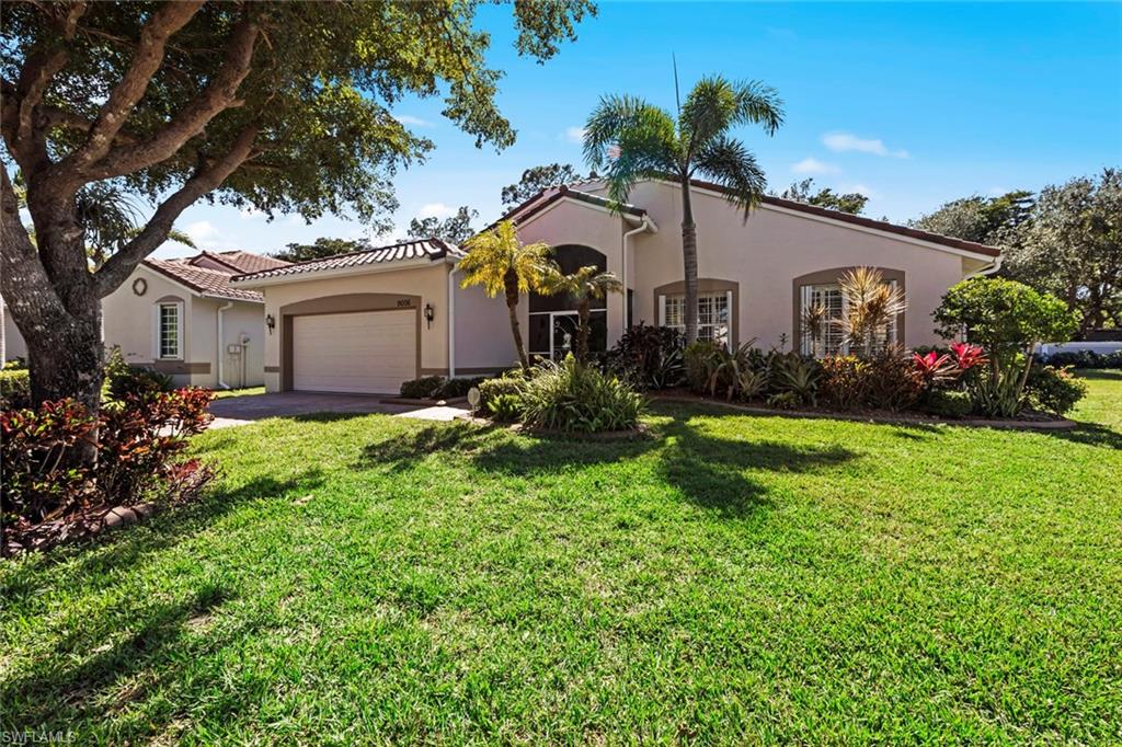 9006 Whitfield Drive Estero, FL 33928 - Photo 3 of 43 a house view with a garden space