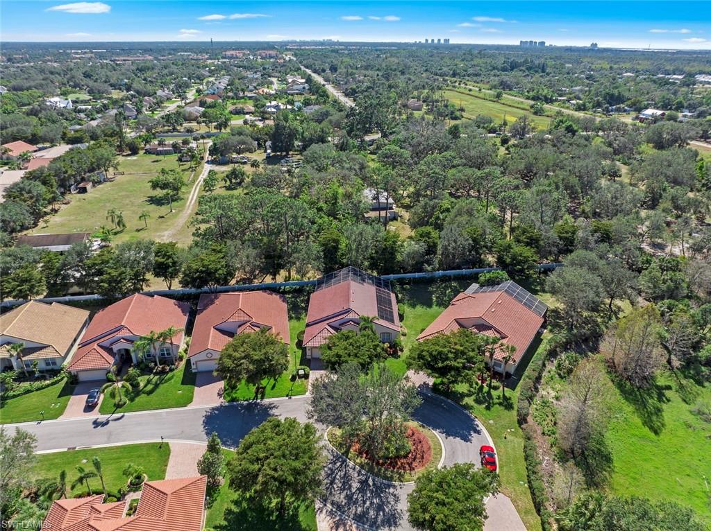 9006 Whitfield Drive Estero, FL 33928 - Photo 31 of 43 an aerial view of a house with a garden