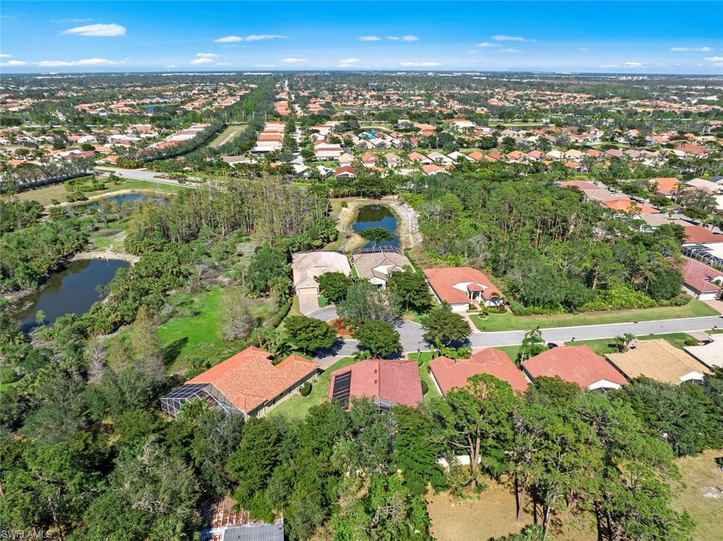 9006 Whitfield Drive Estero, FL 33928 - Photo 32 of 43 an aerial view of residential houses with outdoor space