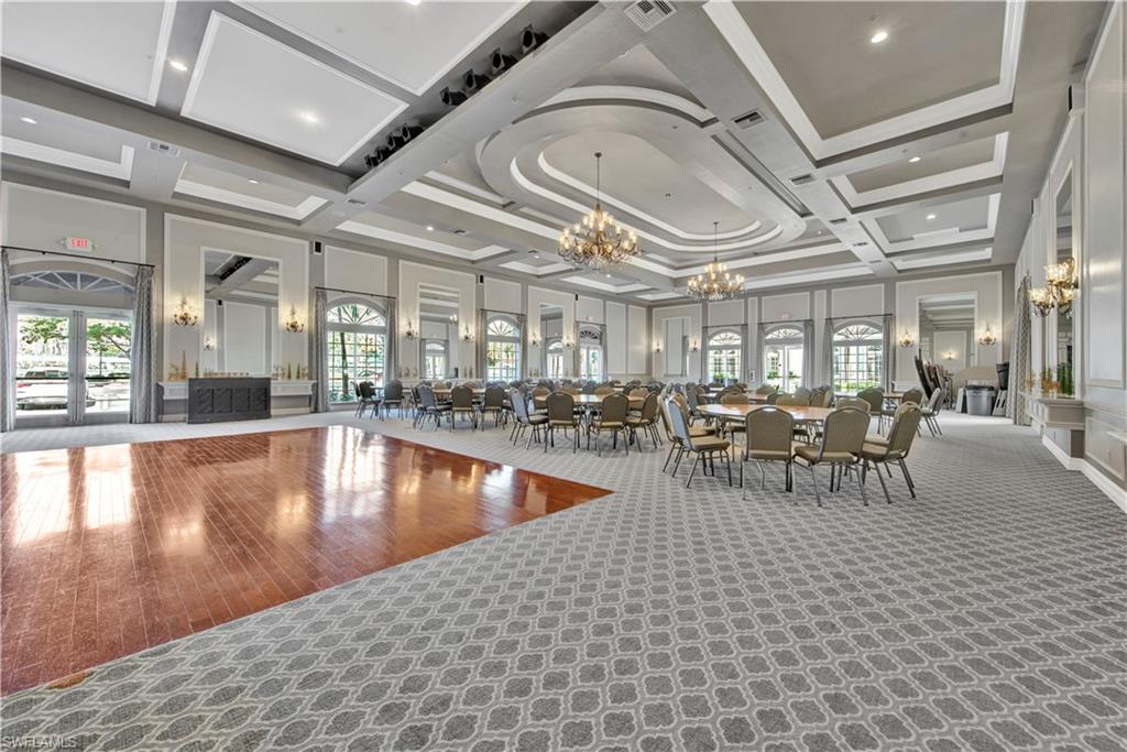 9006 Whitfield Drive Estero, FL 33928 - Photo 36 of 43 a view of a lobby with table and chairs