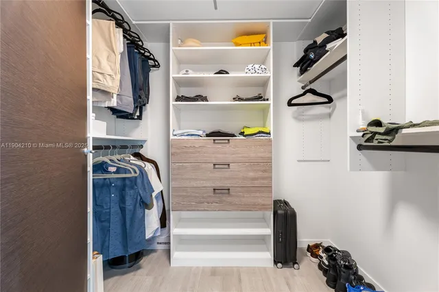 a bathroom with double vanity sinks double vanity tub and a mirror
