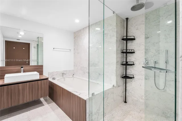 a bedroom with a bed a desk and chair