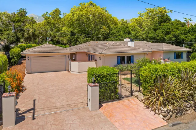 front view of a house with a garden