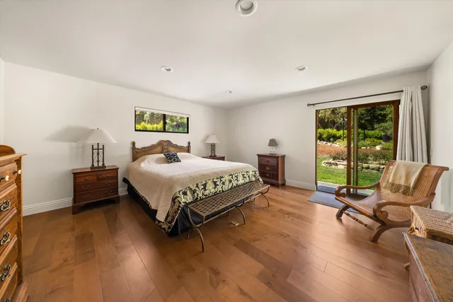 a bedroom with a bed and a chair