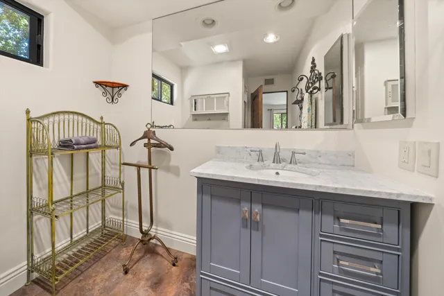 a bathroom with a sink double vanity and a shower