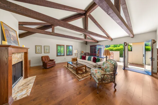 a living room with furniture or fireplace and a wooden floor