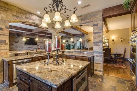 a kitchen with a table and chairs in it