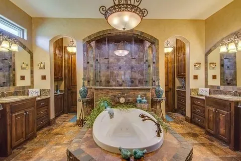 a bathroom with a sink a vanity and a mirror