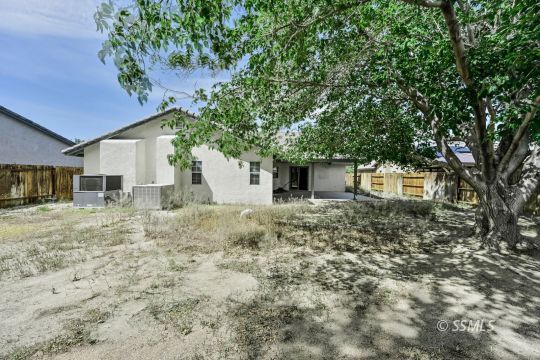 1213 Alysa Court Ridgecrest, CA 93555 - Photo 33 of 34 a backyard of a house with table and chairs