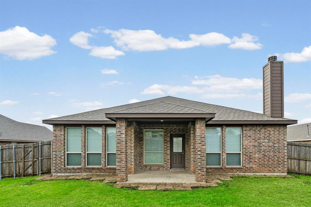 1205 Crest Ridge Drive Glenn Heights, TX 75154 - Photo 25 of 26 a view of a house with a yard and plants