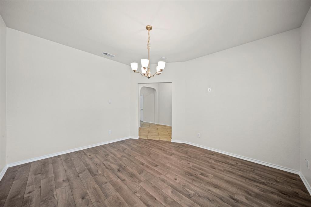 1205 Crest Ridge Drive Glenn Heights, TX 75154 - Photo 10 of 26 a view of a chandelier in a room