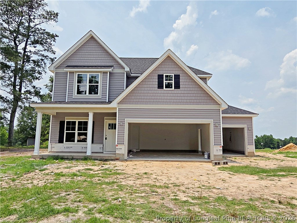 2678 Norrington Road Lillington, NC 27546 - Photo 26 of 31 a front view of a house with a garage