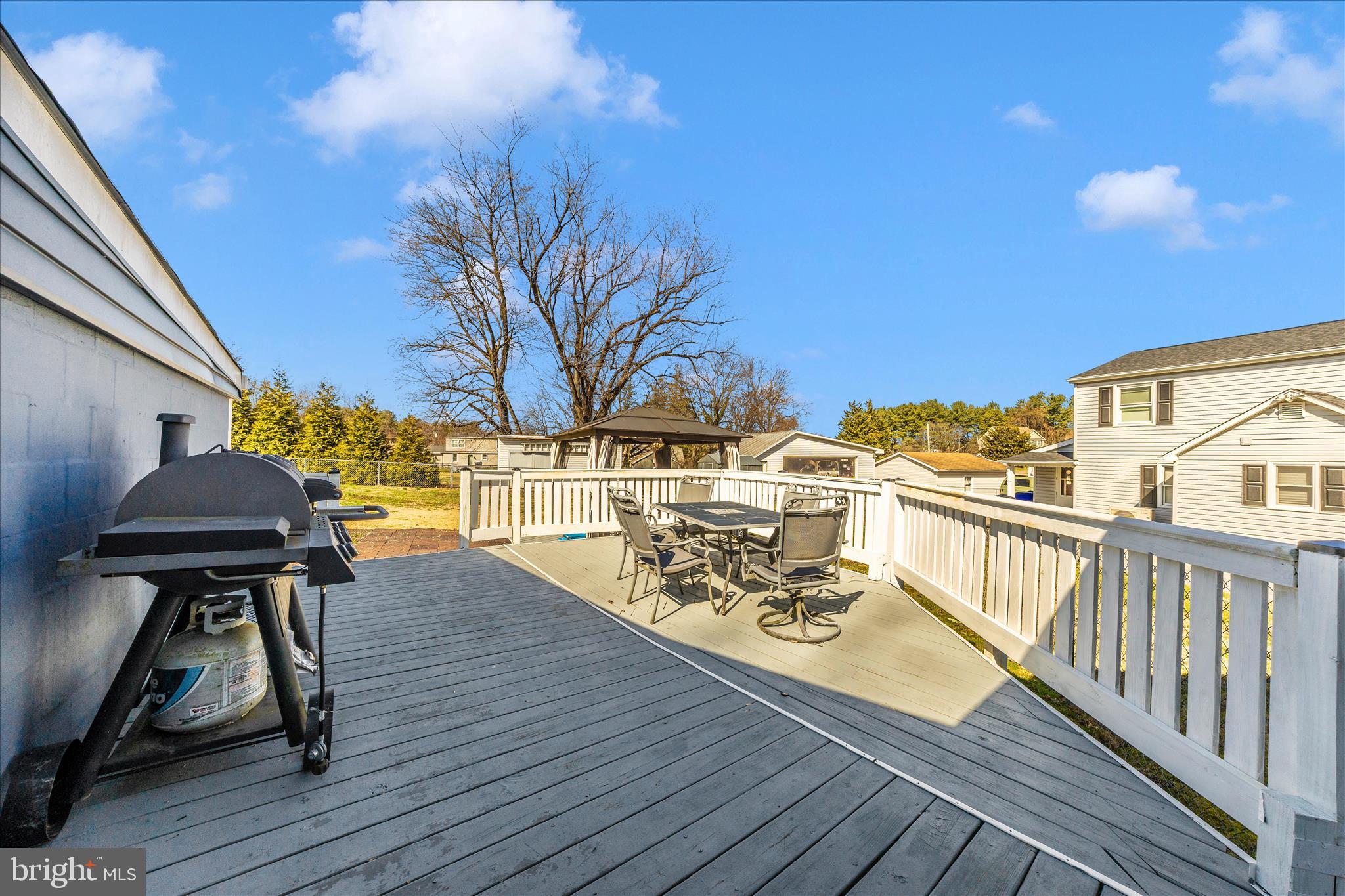 5618 Bartonsville Road Frederick, MD 21704 - Photo 49 of 53 a view of a balcony with chairs and wooden floor