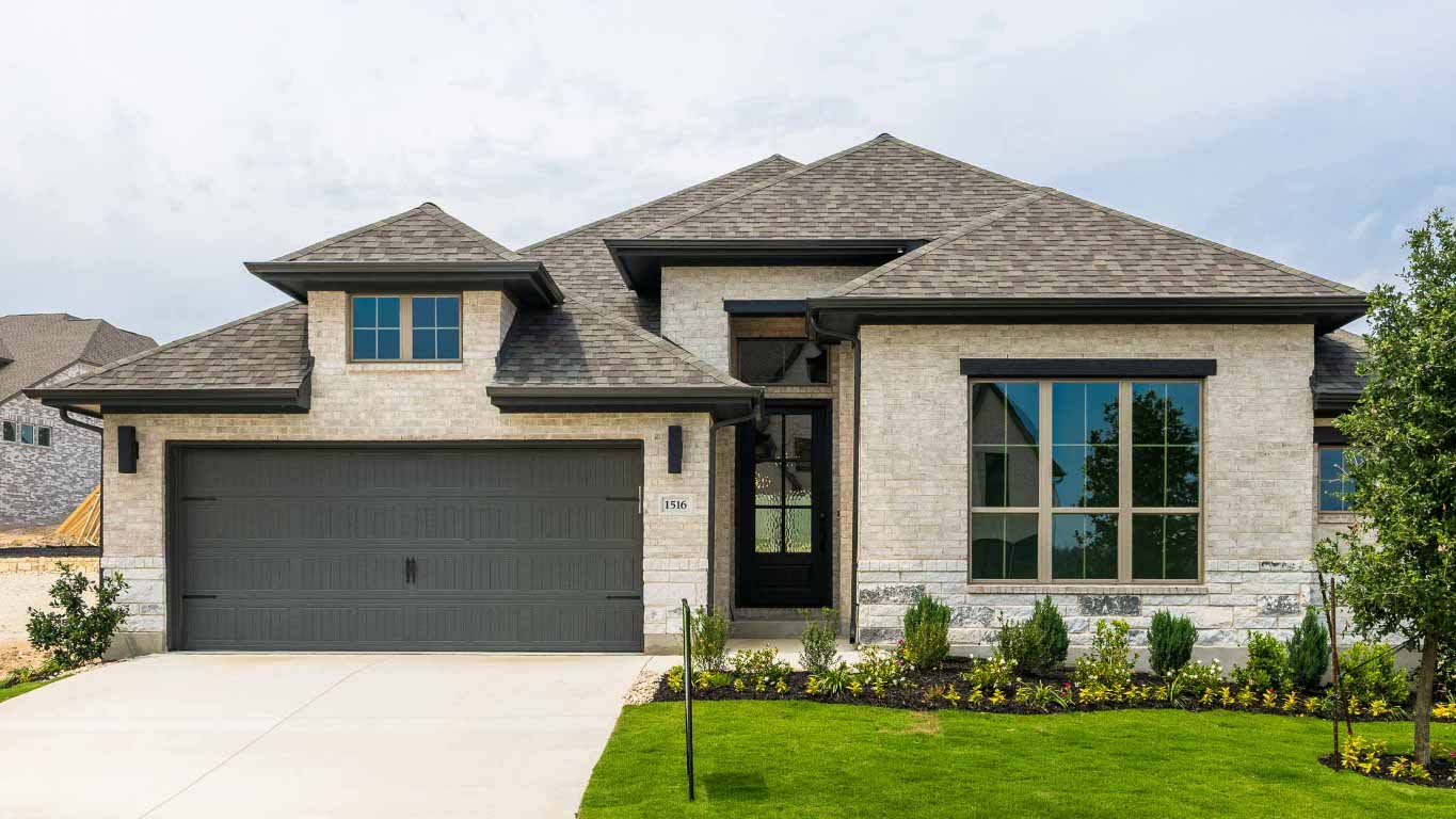 1516 Rodeo Ridge Drive Georgetown, TX 78628 - Photo 1 of 1 a front view of a house with a yard