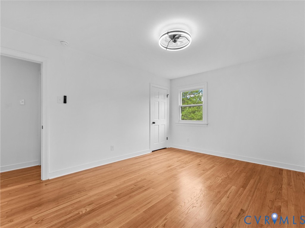 7361 Creek Ridge Road Henrico, VA 23231 - Photo 33 of 51 Hardwood flooring, white walls, and a modern ceili