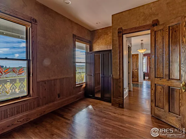 a bathroom with a granite countertop sink a mirror a bathtub and shower