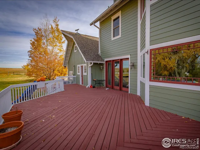 a view of a house with wooden deck