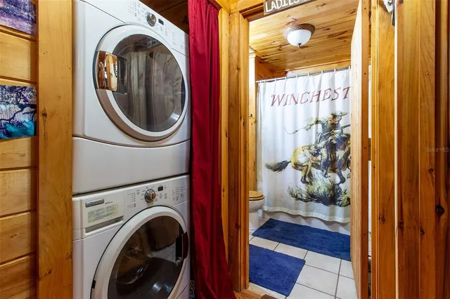 a view of a bedroom with washer and dryer