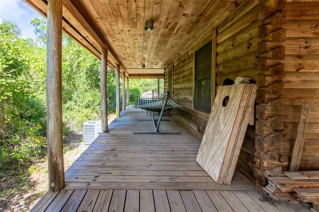 a view of outdoor space with deck and wooden floor