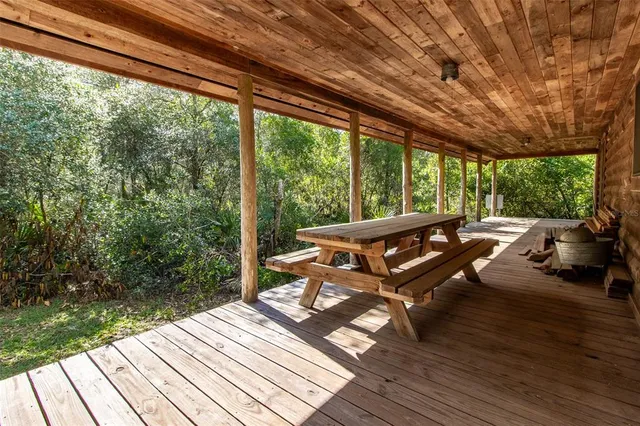 a view of a patio with wooden floor
