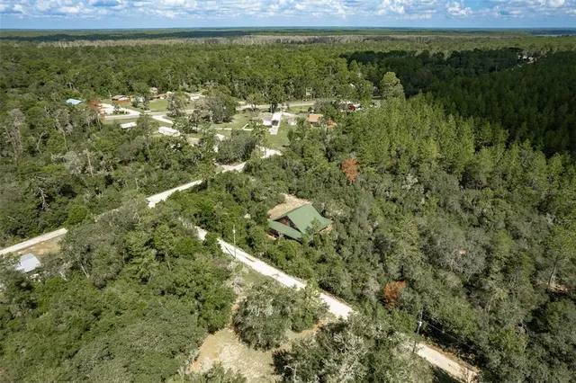a view of a lake with a yard