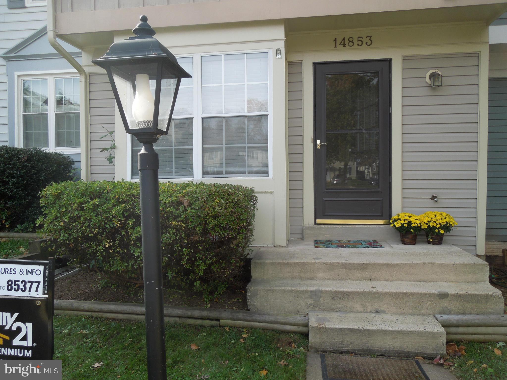 14853 Basingstoke Loop Centreville, VA 20120 - Photo 2 of 30 a front view of a house with garden