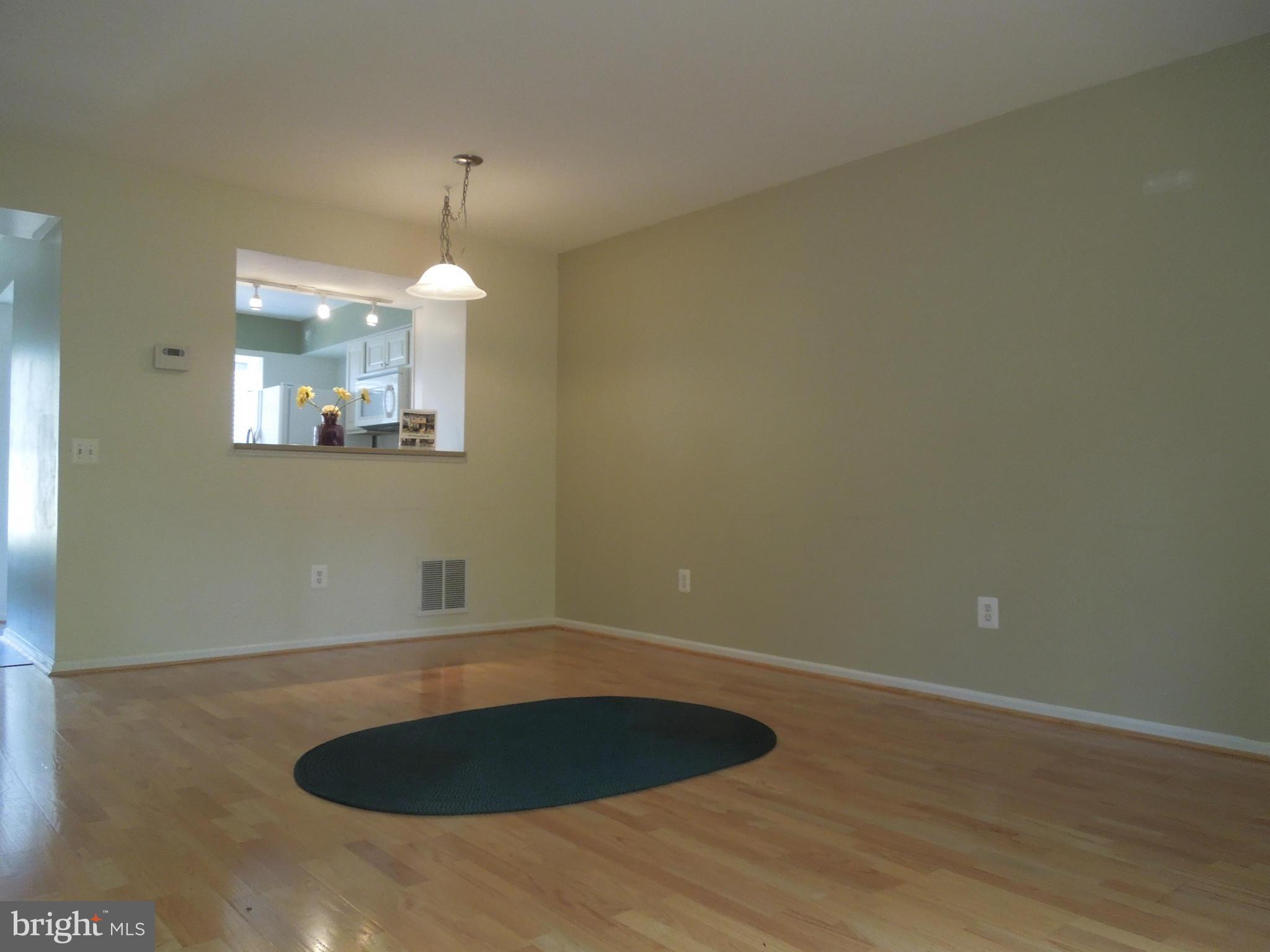 14853 Basingstoke Loop Centreville, VA 20120 - Photo 11 of 30 a room with a chandelier fan and kitchen view