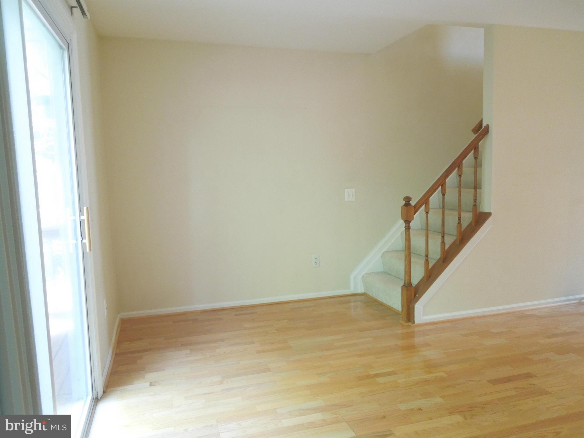 14853 Basingstoke Loop Centreville, VA 20120 - Photo 13 of 30 a view of an entryway with wooden floor