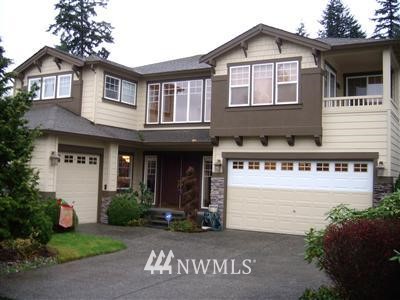 3319 175th Street Southeast Bothell, WA 98012 - Photo 1 of 1 a front view of a house with garden