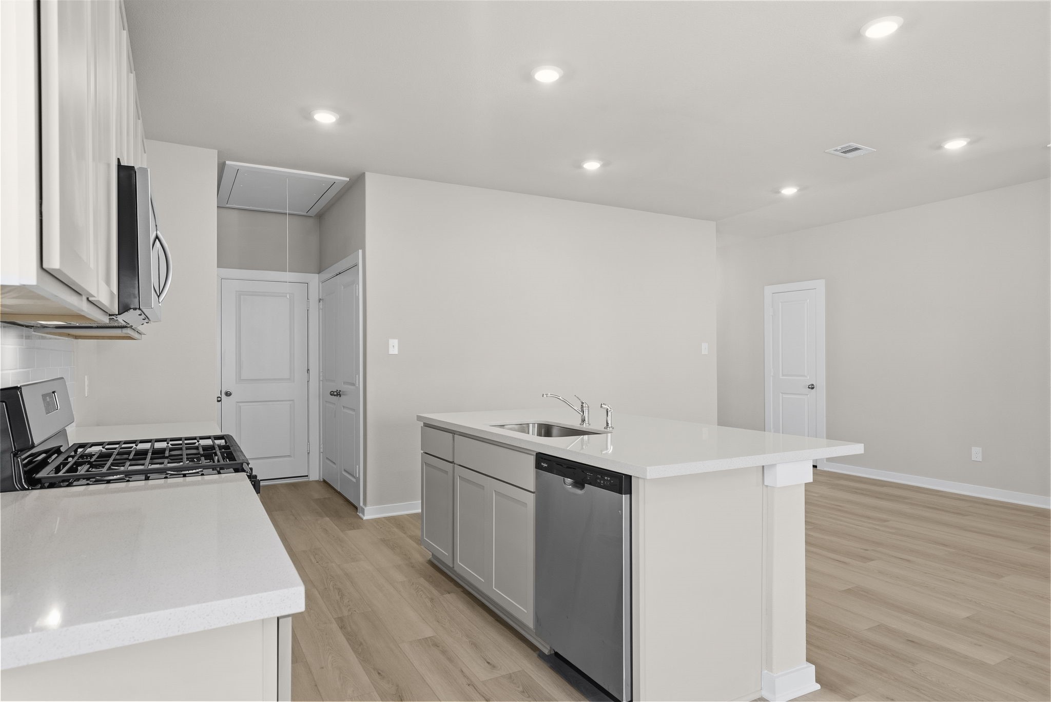 3627 Atlas Pt Lane Angleton, TX 77515 - Photo 7 of 36 a kitchen with a sink and a refrigerator