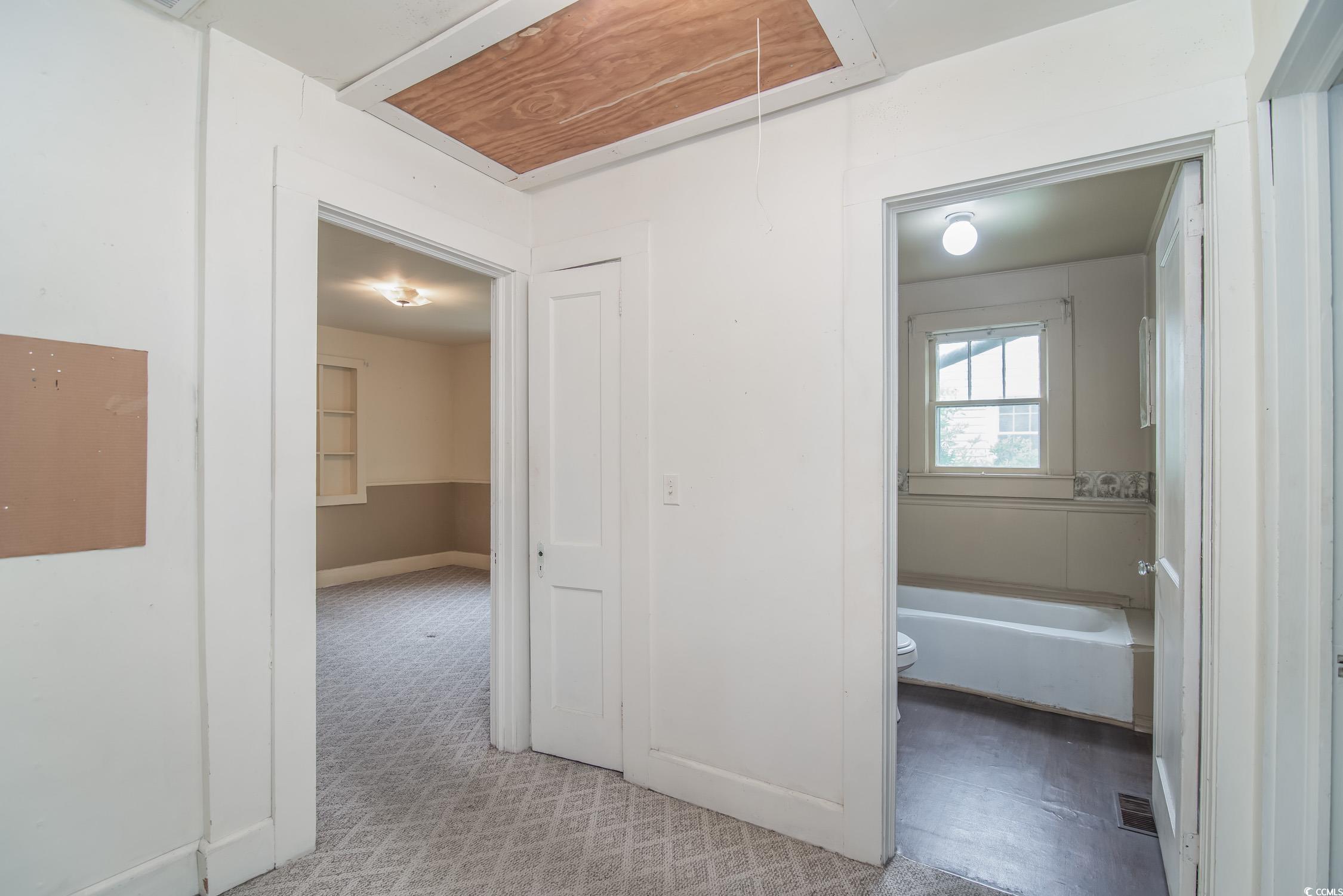 704 North Congdon Street Georgetown, SC 29440 - Photo 19 of 35 Hallway with attic access