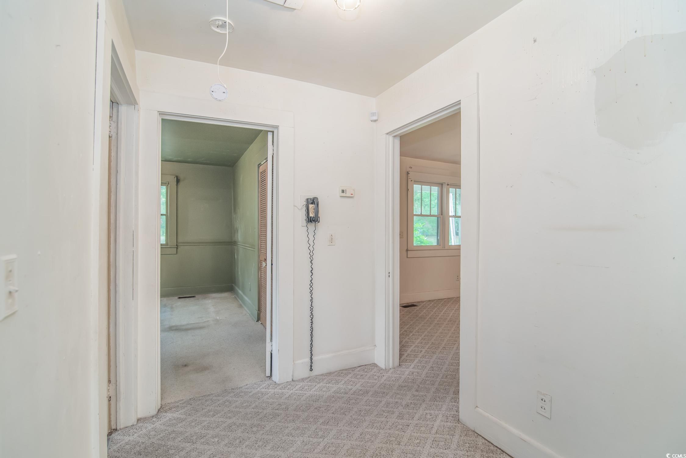 704 North Congdon Street Georgetown, SC 29440 - Photo 20 of 35 Hall with baseboards and light colored carpet