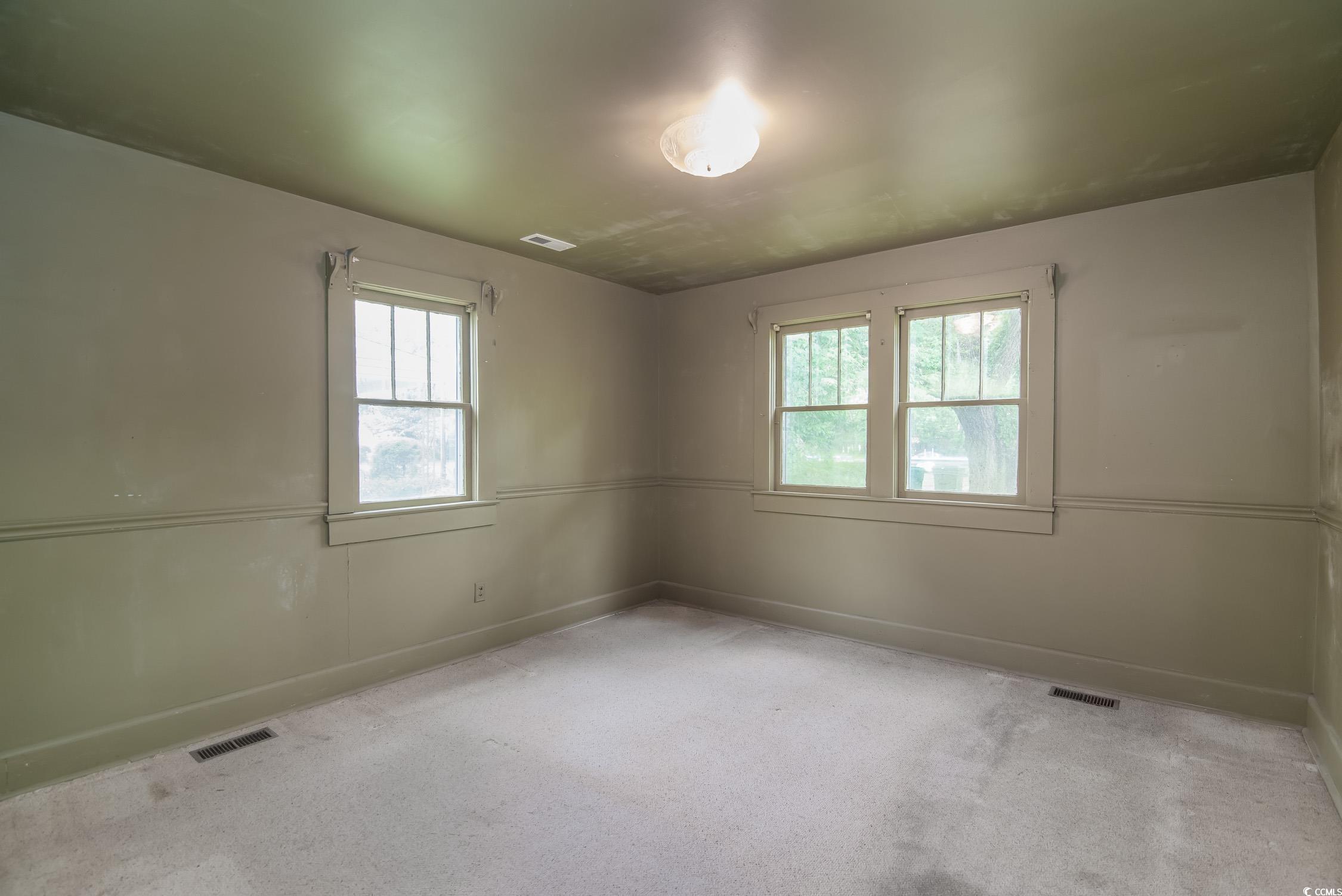 704 North Congdon Street Georgetown, SC 29440 - Photo 22 of 35 Spare room with baseboards and carpet flooring
