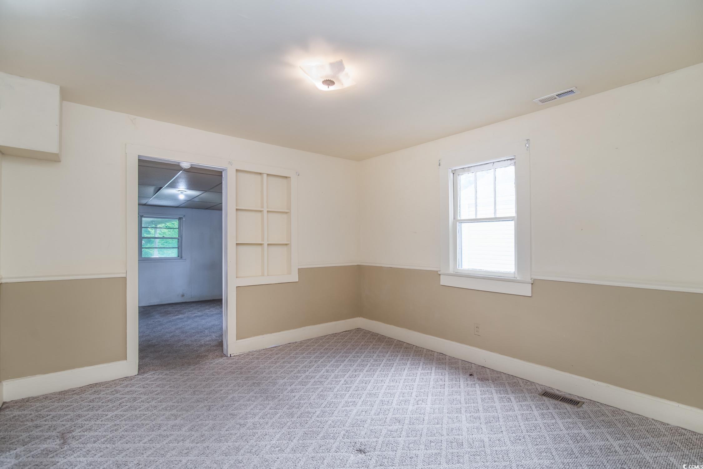 704 North Congdon Street Georgetown, SC 29440 - Photo 24 of 35 Spare room featuring carpet floors and baseboards