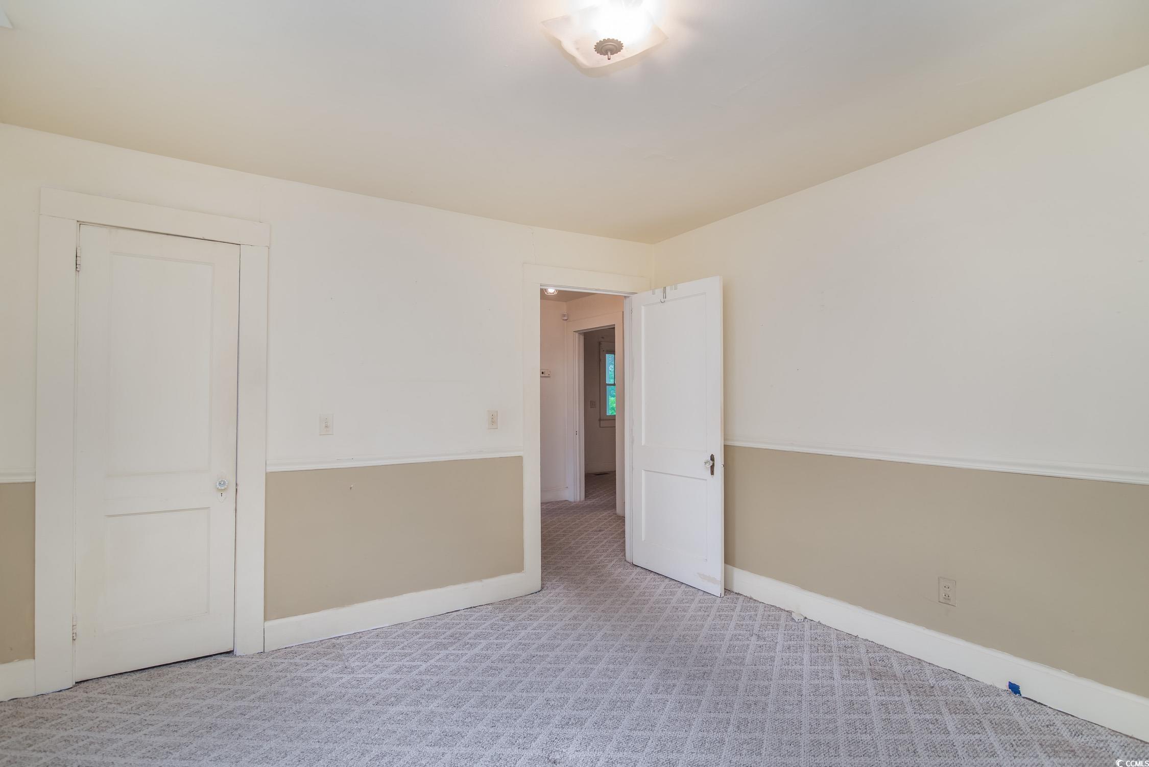 704 North Congdon Street Georgetown, SC 29440 - Photo 25 of 35 Unfurnished room featuring baseboards and carpet flooring