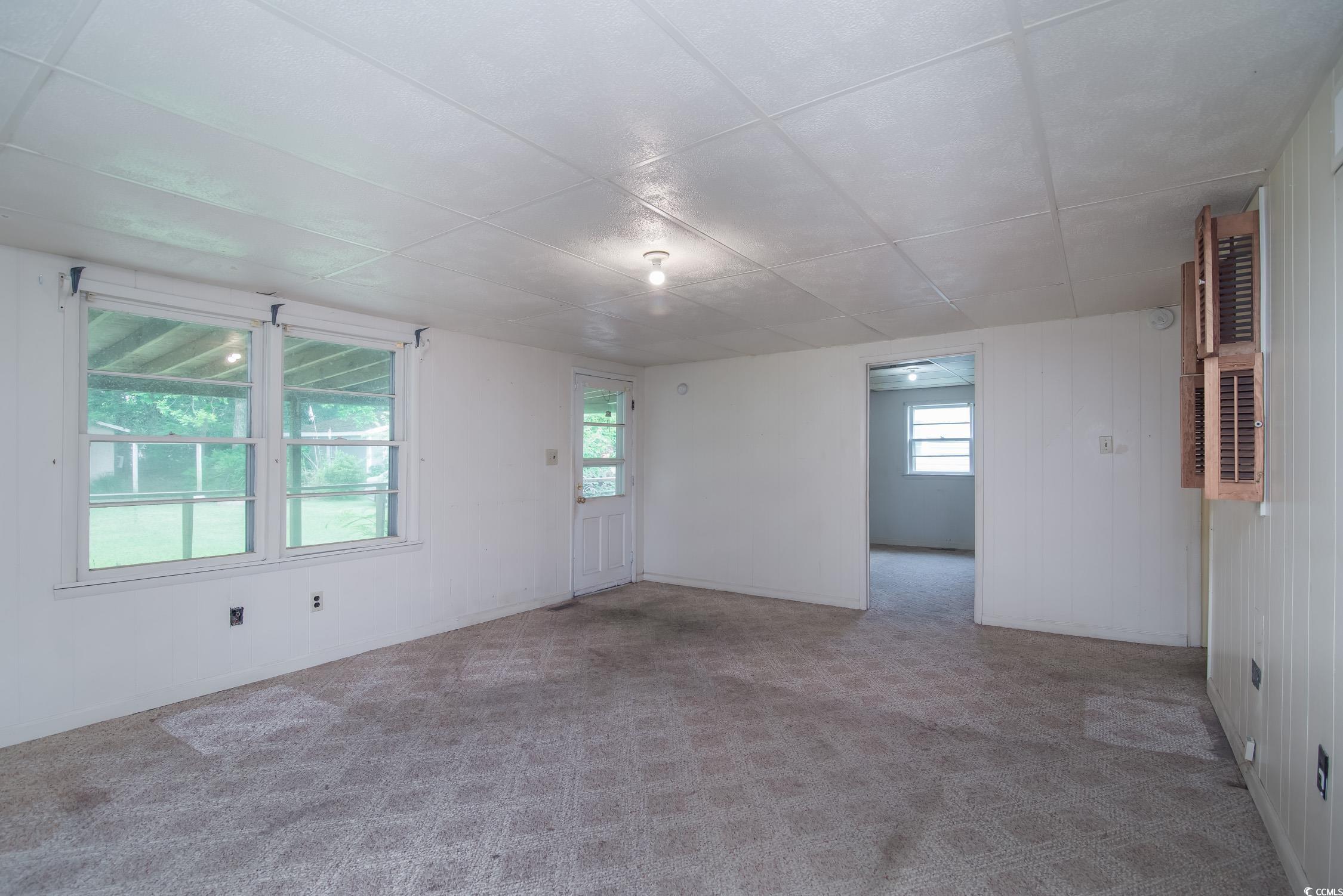 704 North Congdon Street Georgetown, SC 29440 - Photo 30 of 35 Spare room featuring healthy amount of natural light and carpet