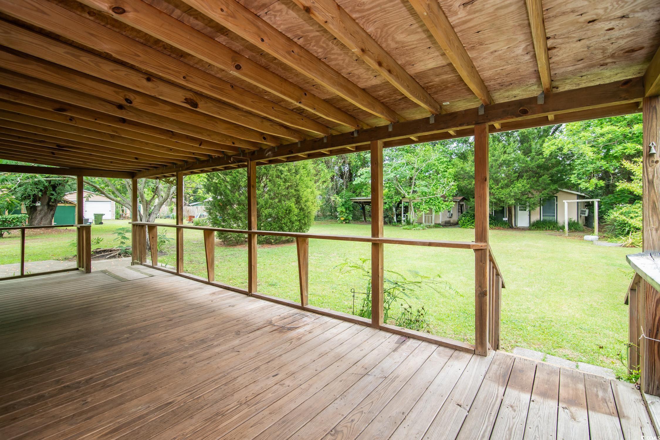 704 North Congdon Street Georgetown, SC 29440 - Photo 31 of 35 Wooden deck with an outbuilding and a yard