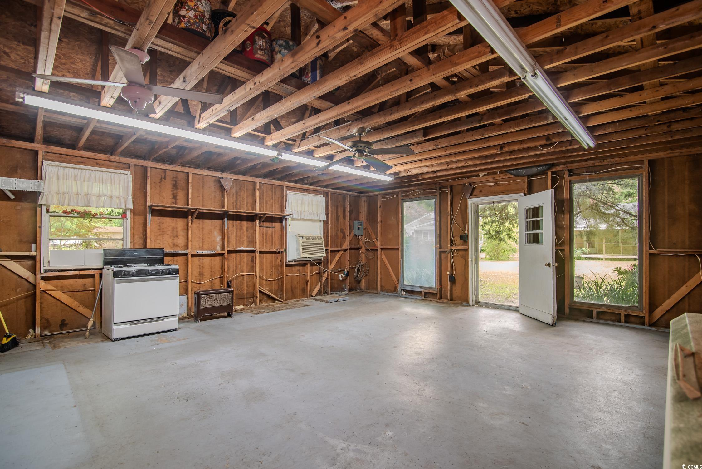 704 North Congdon Street Georgetown, SC 29440 - Photo 34 of 35 Misc room featuring concrete floors, a garage, and cooling unit