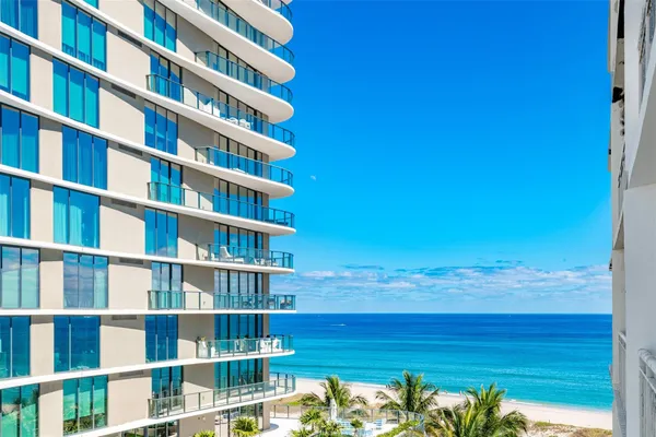 a view of a swimming pool with a table and chairs
