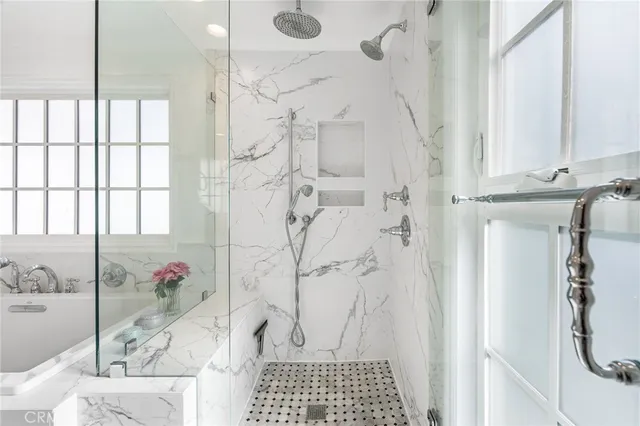 a bathroom with a double vanity sink and a mirror