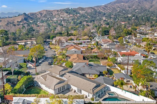 an aerial view of a house with outdoor space